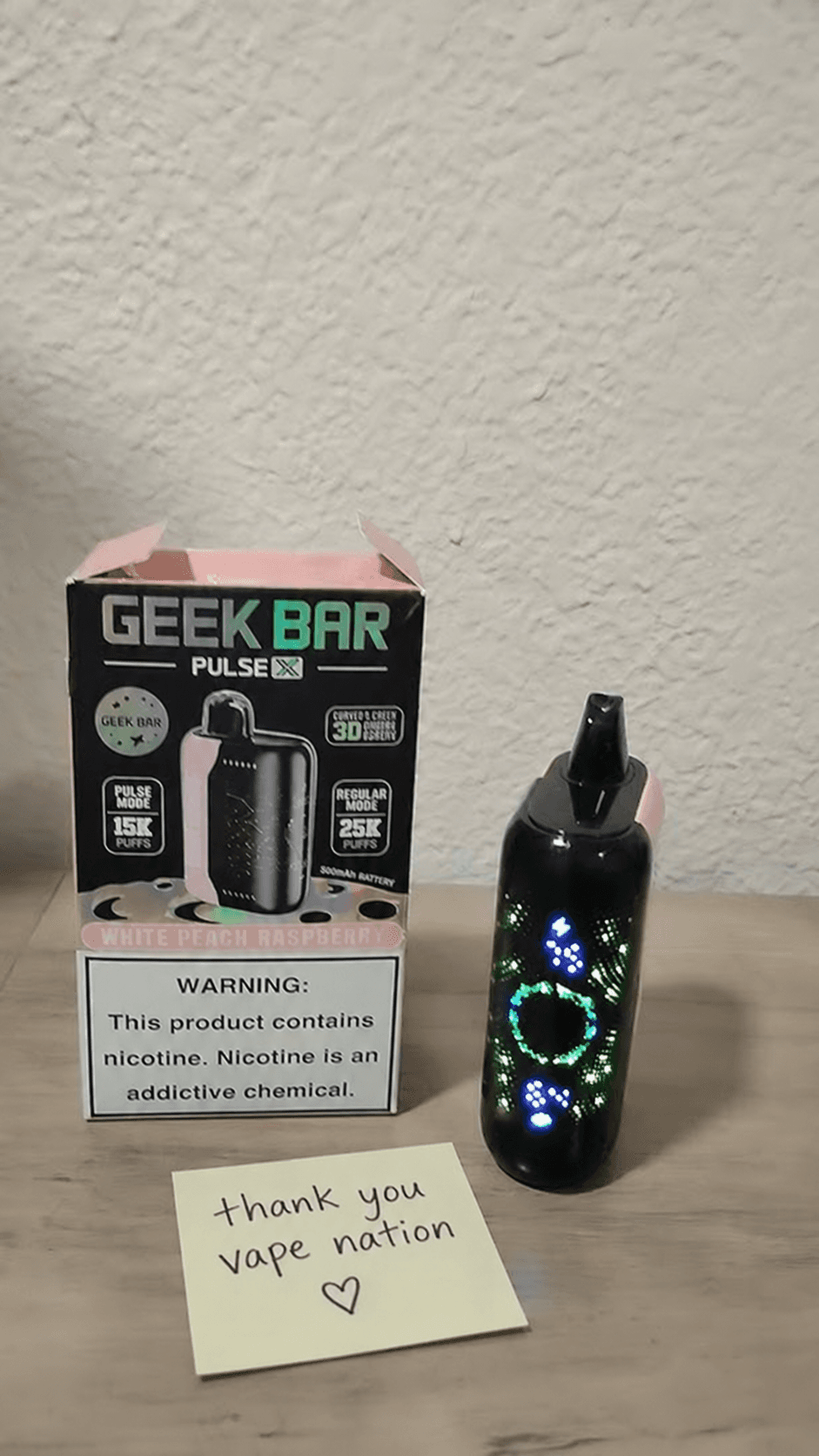 Customer photo of a Geek Bar Pulse X with a thank-you note